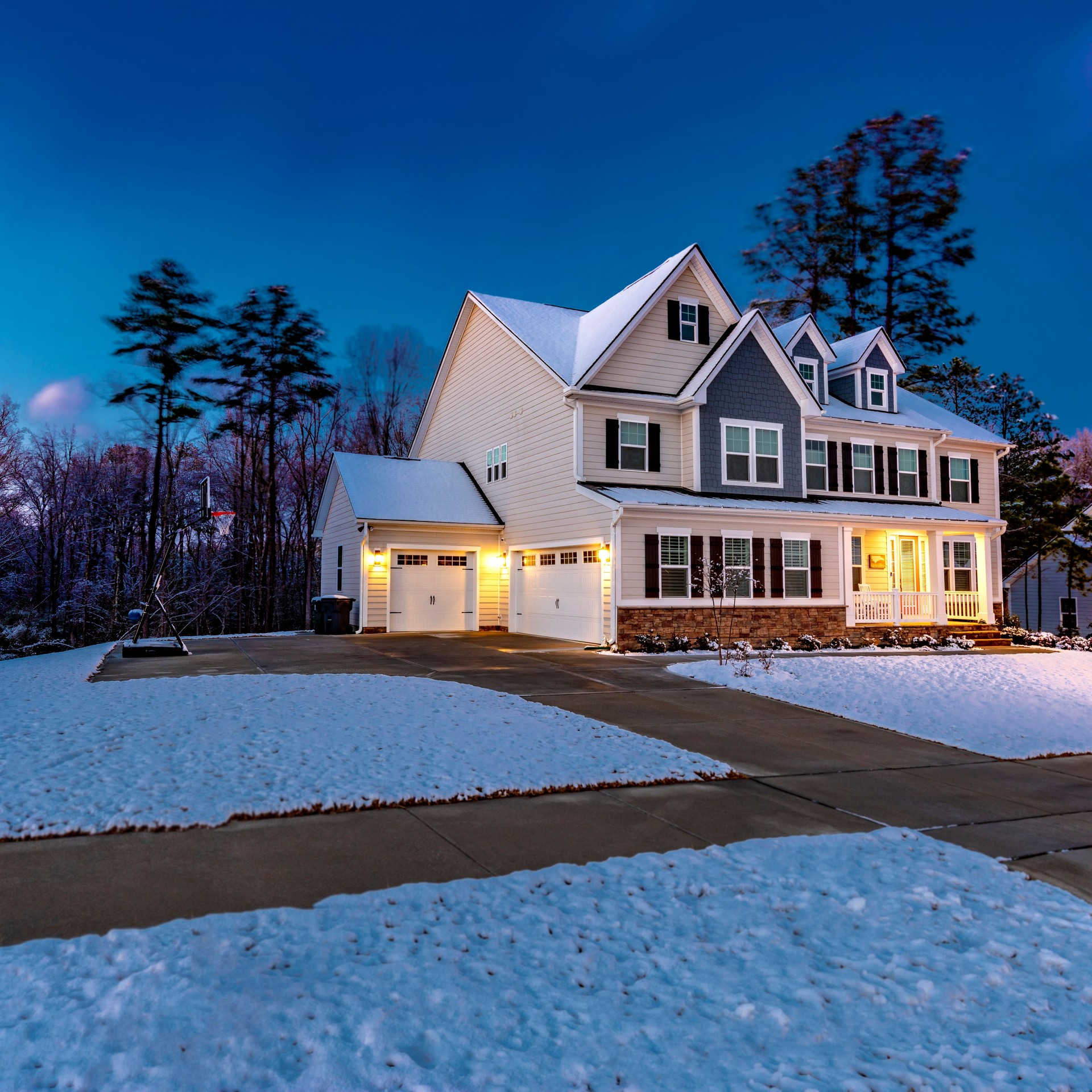 Beautiful luxury home with snow at dawn